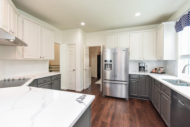 9611 Haven Crossing Ct, Houston, TX 77065 - kitchen featuring stainless steel appliances, gray cabinetry, a sink, dark wood-style flooring, and backsplash
