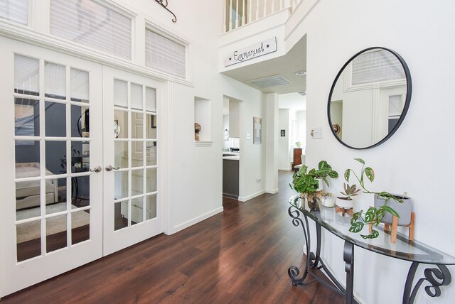 9611 Haven Crossing Ct, Houston, TX 77065 - hall with dark wood-type flooring, french doors, baseboards, and a high ceiling