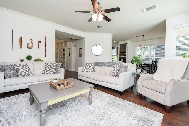 9611 Haven Crossing Ct, Houston, TX 77065 - living area featuring dark wood finished floors, ceiling fan, and ornamental molding