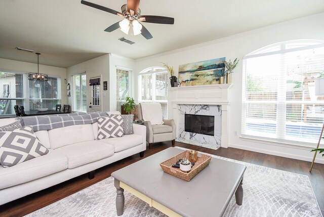 9611 Haven Crossing Ct, Houston, TX 77065 - living room with wood finished floors, a ceiling fan, a premium fireplace, and baseboards