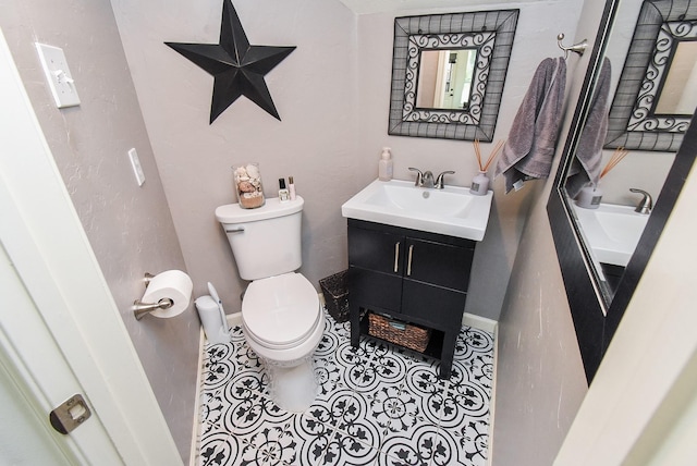 9611 Haven Crossing Ct, Houston, TX 77065 - bathroom with toilet, vanity, tile patterned floors, and baseboards