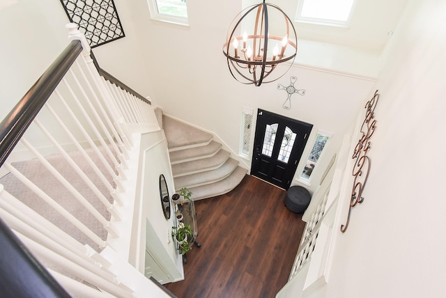 9611 Haven Crossing Ct, Houston, TX 77065 - foyer entrance with stairs, a high ceiling, wood finished floors, and a chandelier