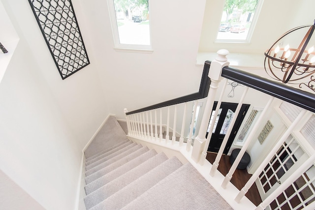 9611 Haven Crossing Ct, Houston, TX 77065 - stairs with a towering ceiling and a chandelier