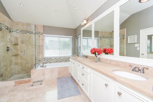 9611 Haven Crossing Ct, Houston, TX 77065 - full bath featuring lofted ceiling, a bath, a shower stall, double vanity, and tile patterned floors