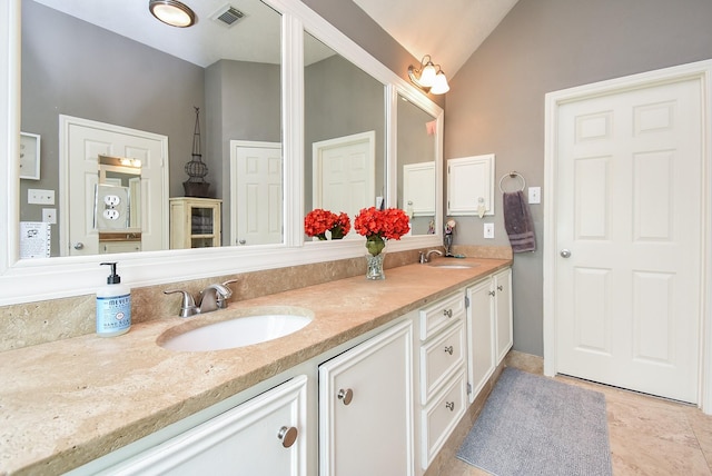9611 Haven Crossing Ct, Houston, TX 77065 - bathroom featuring double vanity and lofted ceiling