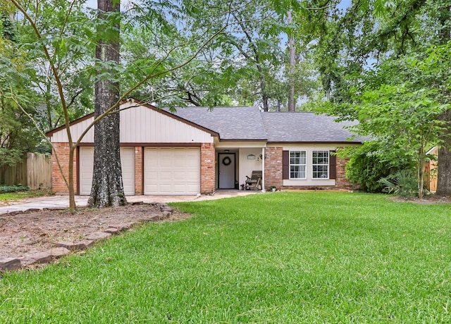 2138 Middle Creek Dr, Houston, TX 77339 - view of front facade featuring an attached garage, concrete driveway, roof with shingles, and brick siding