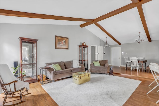 2138 Middle Creek Dr, Houston, TX 77339 - living area featuring wood finished floors, a chandelier, and baseboards