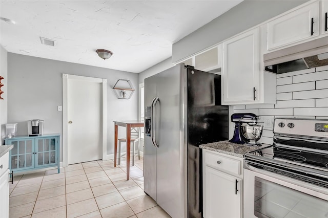 2138 Middle Creek Dr, Houston, TX 77339 - kitchen featuring appliances with stainless steel finishes, white cabinets, custom exhaust hood, tasteful backsplash, and light tile patterned flooring