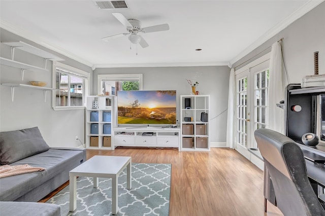 2138 Middle Creek Dr, Houston, TX 77339 - living room featuring crown molding, ceiling fan, and wood finished floors