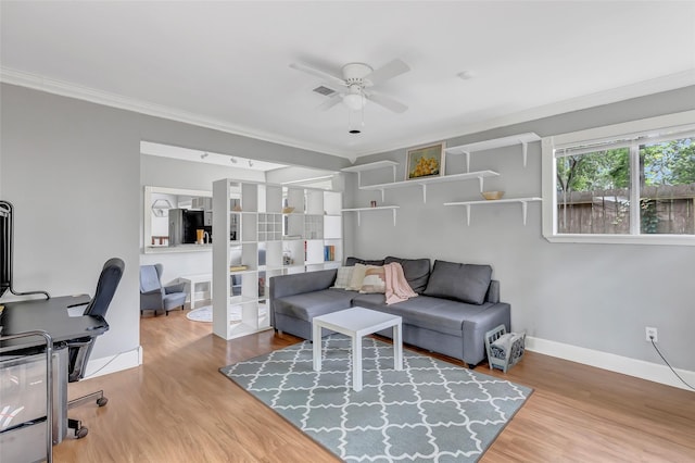2138 Middle Creek Dr, Houston, TX 77339 - living area featuring ceiling fan, ornamental molding, wood finished floors, and baseboards