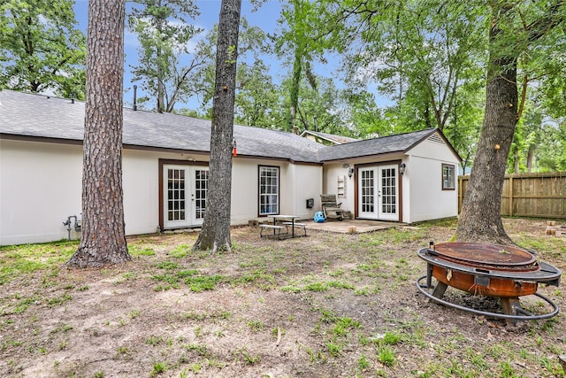 2138 Middle Creek Dr, Houston, TX 77339 - rear view of house featuring french doors, an outdoor fire pit, a patio area, and roof with shingles