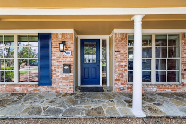 7811 Skyline Dr, Houston, TX 77063 - view of exterior entry with brick siding and a porch