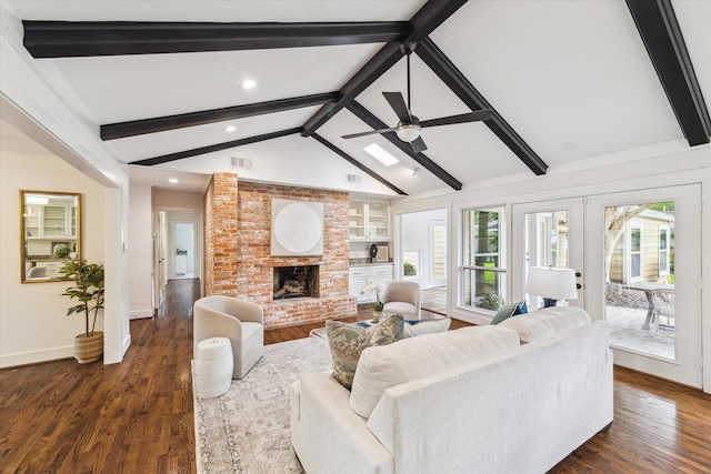 7811 Skyline Dr, Houston, TX 77063 - living area with dark wood-style floors, a brick fireplace, recessed lighting, french doors, and baseboards