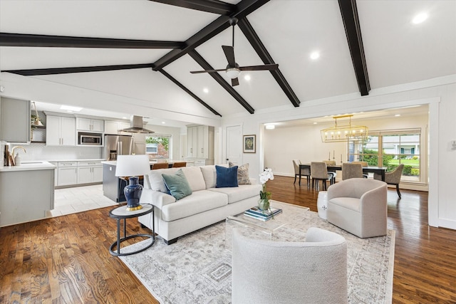 7811 Skyline Dr, Houston, TX 77063 - living room featuring ceiling fan, light wood-type flooring, recessed lighting, and a chandelier