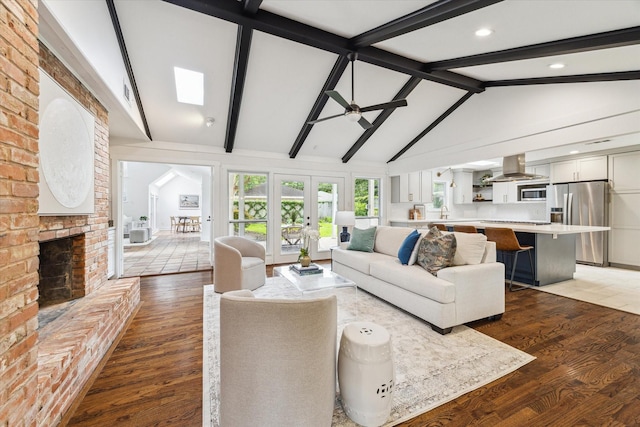 7811 Skyline Dr, Houston, TX 77063 - living room with a ceiling fan, a brick fireplace, and dark wood-type flooring
