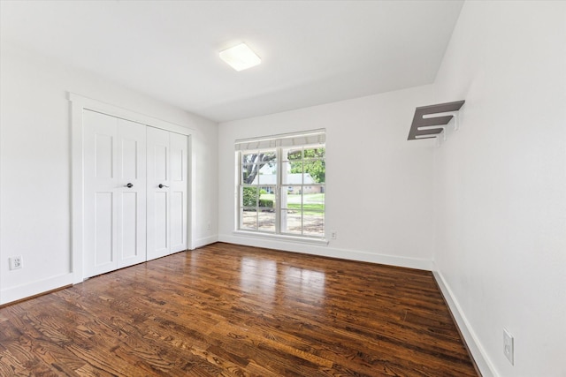 7811 Skyline Dr, Houston, TX 77063 - unfurnished bedroom featuring wood finished floors, baseboards, and a closet