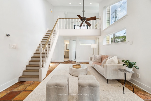 7811 Skyline Dr, Houston, TX 77063 - living area with stairs, a towering ceiling, ceiling fan, and recessed lighting