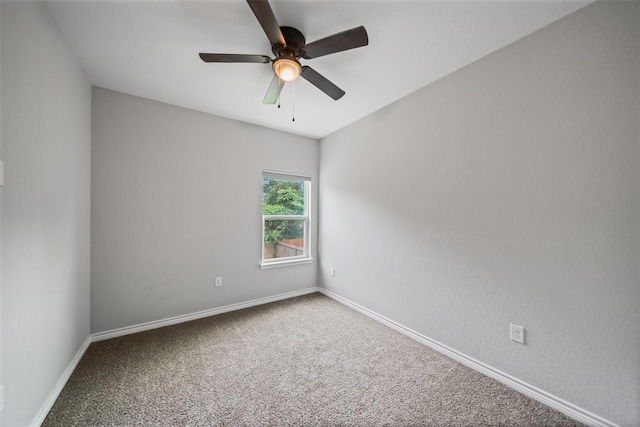 4006 Frontier Rd, Willis, TX 77378 - spare room with a ceiling fan, carpet, and baseboards