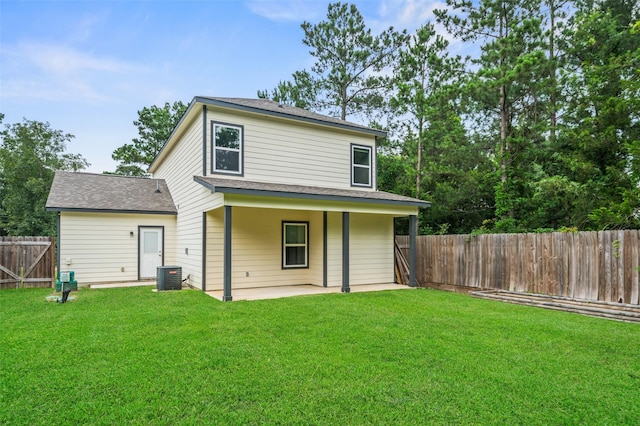 4006 Frontier Rd, Willis, TX 77378 - rear view of house featuring a patio area, central air condition unit, and roof with shingles