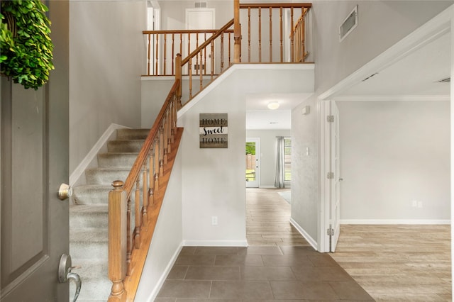 14515 Redbud Valley Trl, Houston, TX 77062 - stairs featuring baseboards, crown molding, and wood finished floors