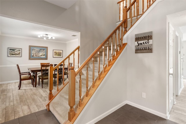 14515 Redbud Valley Trl, Houston, TX 77062 - stairway featuring crown molding, baseboards, and tile patterned flooring