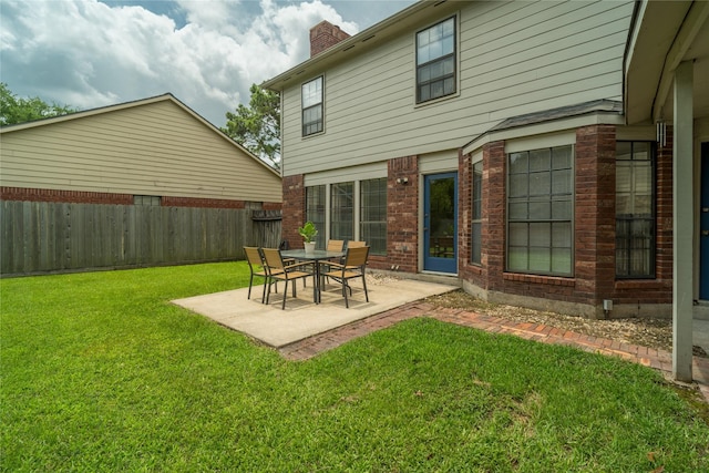 14515 Redbud Valley Trl, Houston, TX 77062 - back of house with a patio area, a chimney, and brick siding