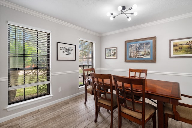 14515 Redbud Valley Trl, Houston, TX 77062 - dining space with a chandelier, ornamental molding, wood finished floors, and baseboards