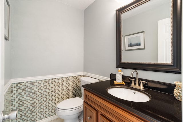 14515 Redbud Valley Trl, Houston, TX 77062 - bathroom featuring toilet, vanity, and a wainscoted wall