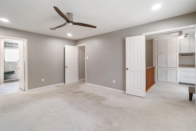 14515 Redbud Valley Trl, Houston, TX 77062 - unfurnished bedroom with light carpet, baseboards, recessed lighting, a ceiling fan, and ensuite bathroom