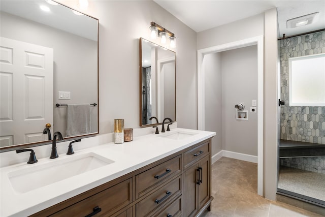 14515 Redbud Valley Trl, Houston, TX 77062 - full bath featuring double vanity, tile patterned flooring, a shower, and baseboards