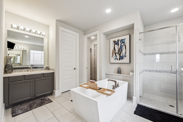 28243 Shorecrest Ln, Katy, TX 77494 - full bathroom with a soaking tub, a shower stall, vanity, tile patterned floors, and recessed lighting