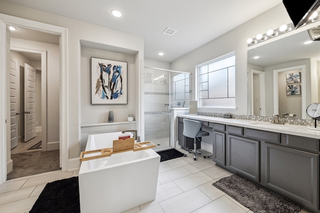 28243 Shorecrest Ln, Katy, TX 77494 - full bathroom with vanity, a shower stall, a freestanding bath, tile patterned floors, and recessed lighting