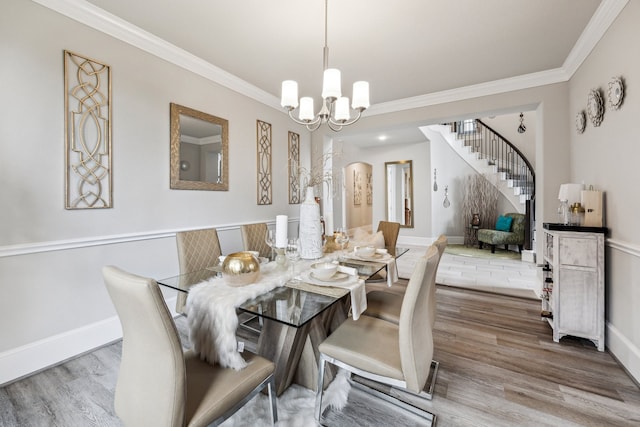 28243 Shorecrest Ln, Katy, TX 77494 - dining room with stairway, crown molding, a chandelier, wood finished floors, and baseboards