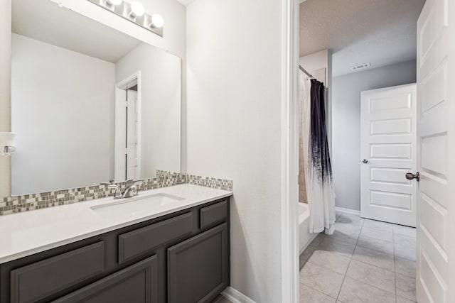 28243 Shorecrest Ln, Katy, TX 77494 - bathroom with vanity, tile patterned flooring, shower / bathtub combination with curtain, and baseboards
