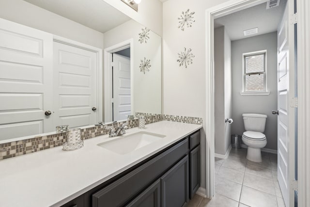 28243 Shorecrest Ln, Katy, TX 77494 - bathroom featuring vanity, toilet, baseboards, and tile patterned flooring