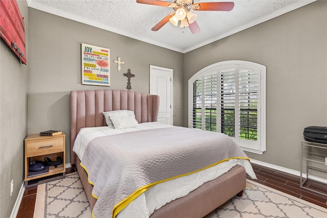 2205 Erin Glen Ct, Deer Park, TX 77536 - bedroom featuring crown molding, baseboards, wood finished floors, ceiling fan, and a textured ceiling