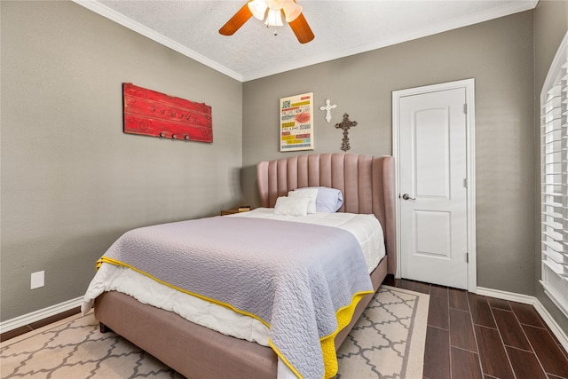 2205 Erin Glen Ct, Deer Park, TX 77536 - bedroom with baseboards, dark wood-style floors, crown molding, and ceiling fan
