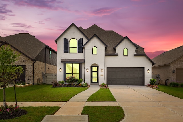 5115 Prairie Gourd Mdw, Manvel, TX 77578 - french provincial home featuring concrete driveway, an attached garage, and a shingled roof
