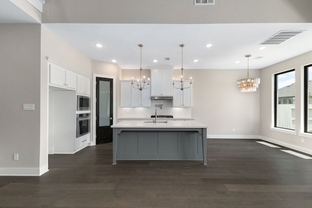 5115 Prairie Gourd Mdw, Manvel, TX 77578 - kitchen featuring a chandelier, appliances with stainless steel finishes, baseboards, and recessed lighting