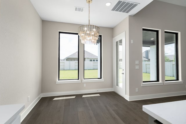 5115 Prairie Gourd Mdw, Manvel, TX 77578 - unfurnished dining area featuring a chandelier, dark wood finished floors, healthy amount of natural light, and baseboards