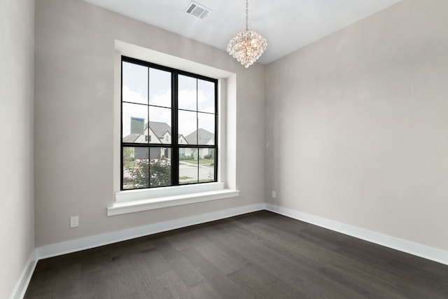 5115 Prairie Gourd Mdw, Manvel, TX 77578 - spare room with a chandelier, dark wood-style floors, and baseboards