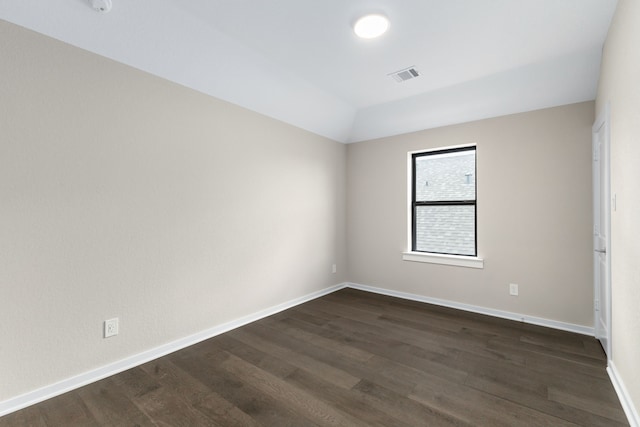 5115 Prairie Gourd Mdw, Manvel, TX 77578 - unfurnished room featuring dark wood-type flooring, baseboards, and lofted ceiling