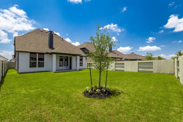 5115 Prairie Gourd Mdw, Manvel, TX 77578 - rear view of property featuring roof with shingles and a chimney