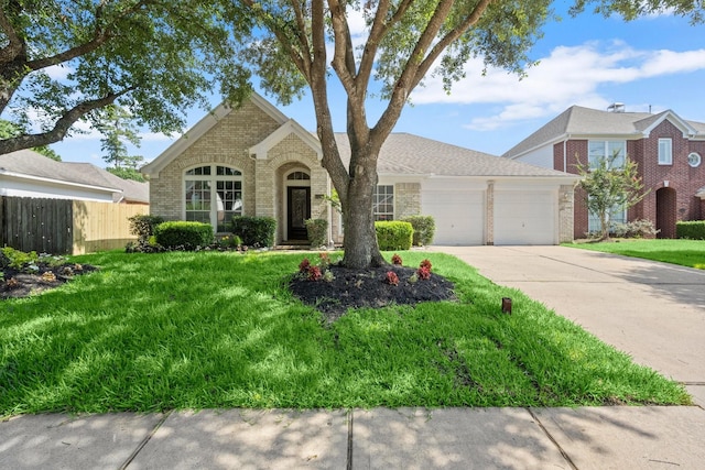 11722 Gray Forest Trl, Tomball, TX 77377 - traditional-style home with brick siding, an attached garage, and driveway