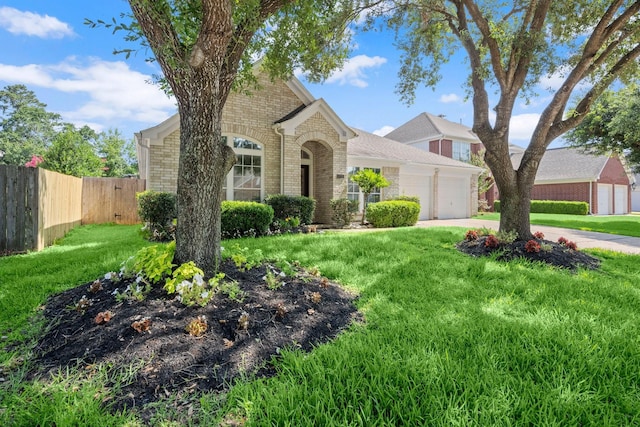 11722 Gray Forest Trl, Tomball, TX 77377 - view of front of home with brick siding, an attached garage, and driveway