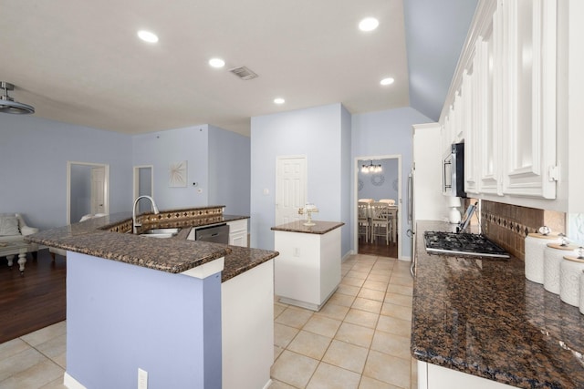 11722 Gray Forest Trl, Tomball, TX 77377 - kitchen featuring a spacious island, light tile patterned flooring, appliances with stainless steel finishes, a sink, and decorative backsplash