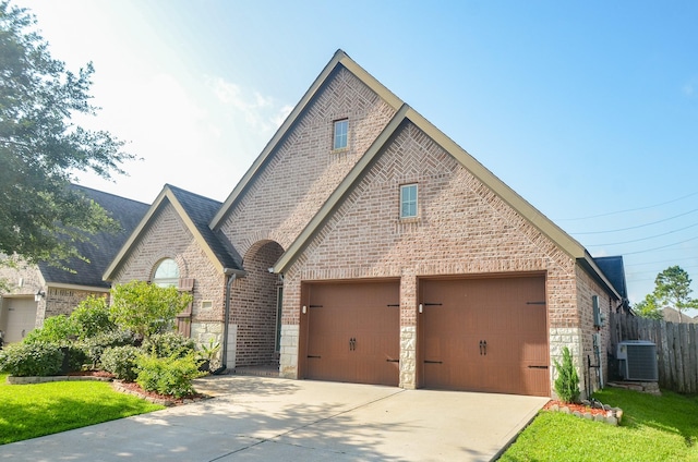 13806 Crystal Harbor Ln, Pearland, TX 77584 - view of front of home with brick siding, cooling unit, and driveway