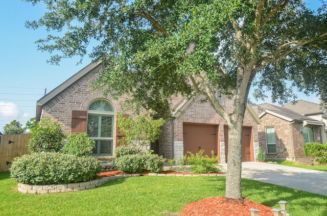 13806 Crystal Harbor Ln, Pearland, TX 77584 - view of front of property with brick siding, driveway, and a garage