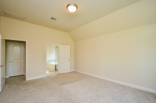 13806 Crystal Harbor Ln, Pearland, TX 77584 - unfurnished bedroom with light colored carpet, baseboards, vaulted ceiling, and connected bathroom
