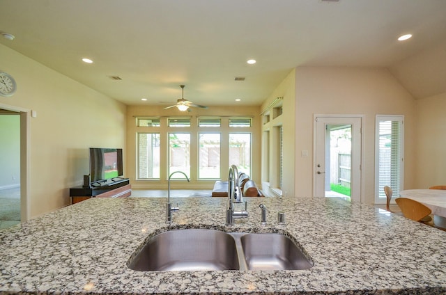 13806 Crystal Harbor Ln, Pearland, TX 77584 - kitchen with a sink, open floor plan, recessed lighting, a ceiling fan, and light stone countertops